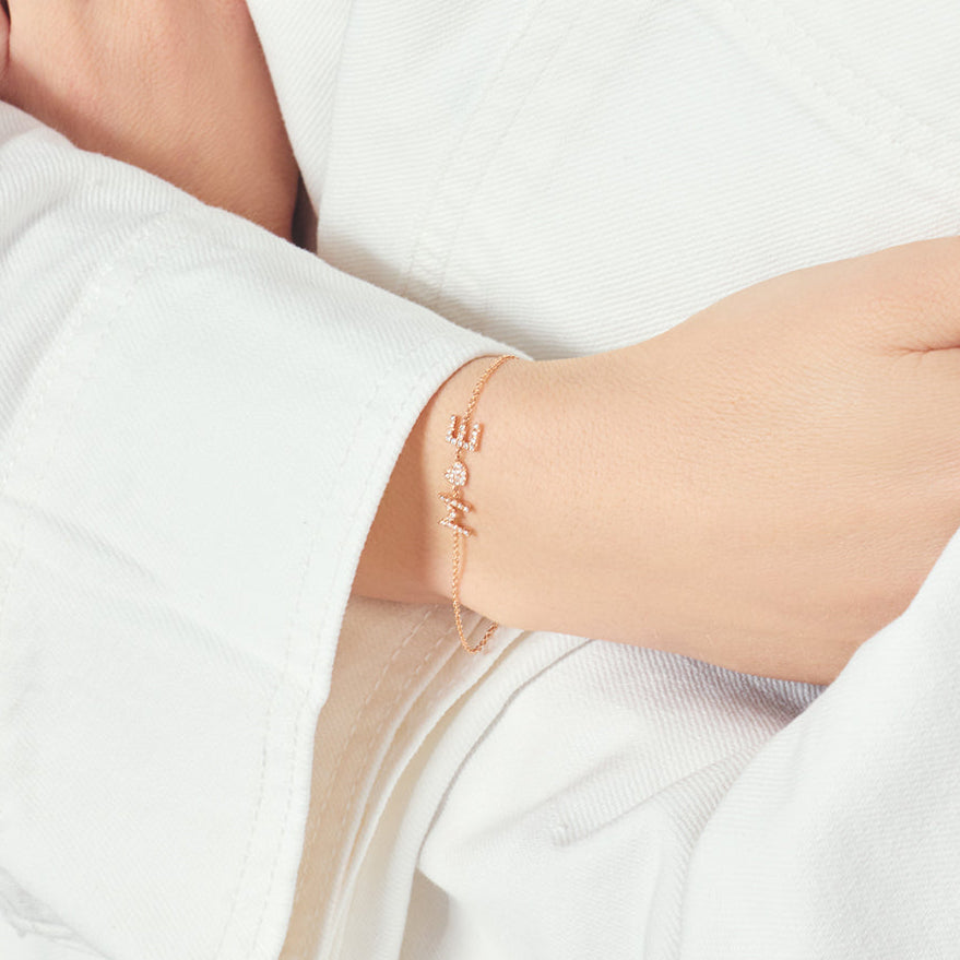 Armband mit Symbolen und Diamanten aus 18 Karat Roségold aus der Kollektion Krebber Colors bei Juwelier Krebber in Mönchengladbach-Rheydt